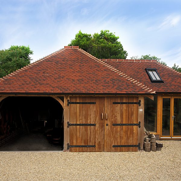 This multi-purpose outbuilding consists of a two-bay frame (K45) used as a garage and workshop area, and a bespoke frame with glazed elevations which is used as a craft studio.
